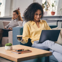 Woman enjoying coffee while working